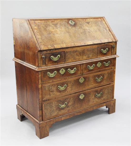 An early 18th century featherbanded walnut bureau, W.3ft 2in.